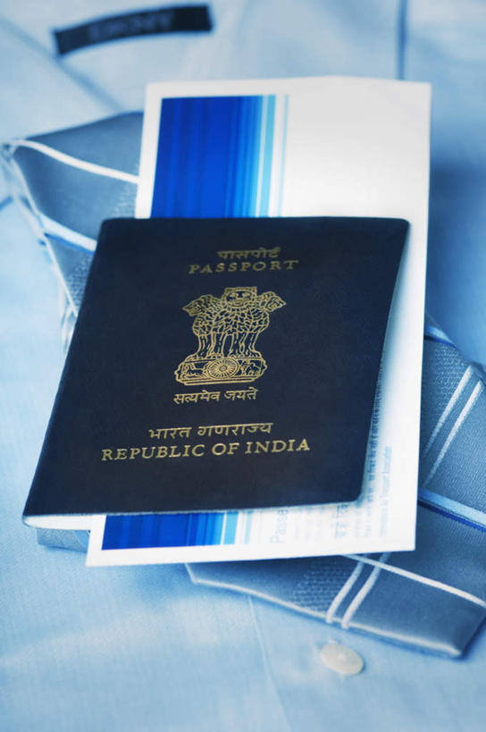 无人,竖图,俯视,室内,特写,白天,衬衫,桌面,桌子,静物,木制,英文,标志,文字,字符,字母,标识,本子,木制品,英文字母,护照,证明,通行,身份,彩图,高角度拍摄,衬衣,机票